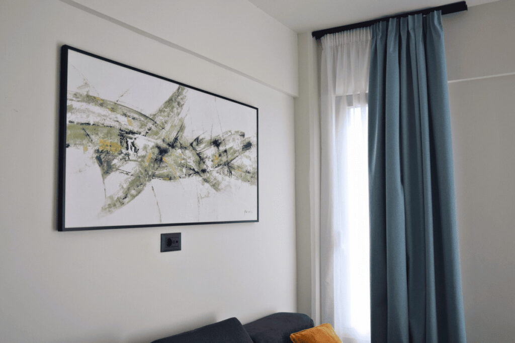 Living room with decorative wall art in Duo Verde apartment in Kremasti Rhodes