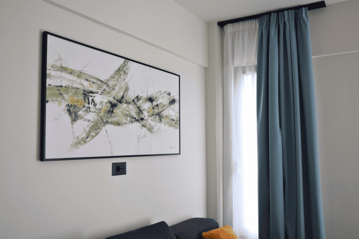 Living room with decorative wall art in Duo Verde apartment in Kremasti Rhodes