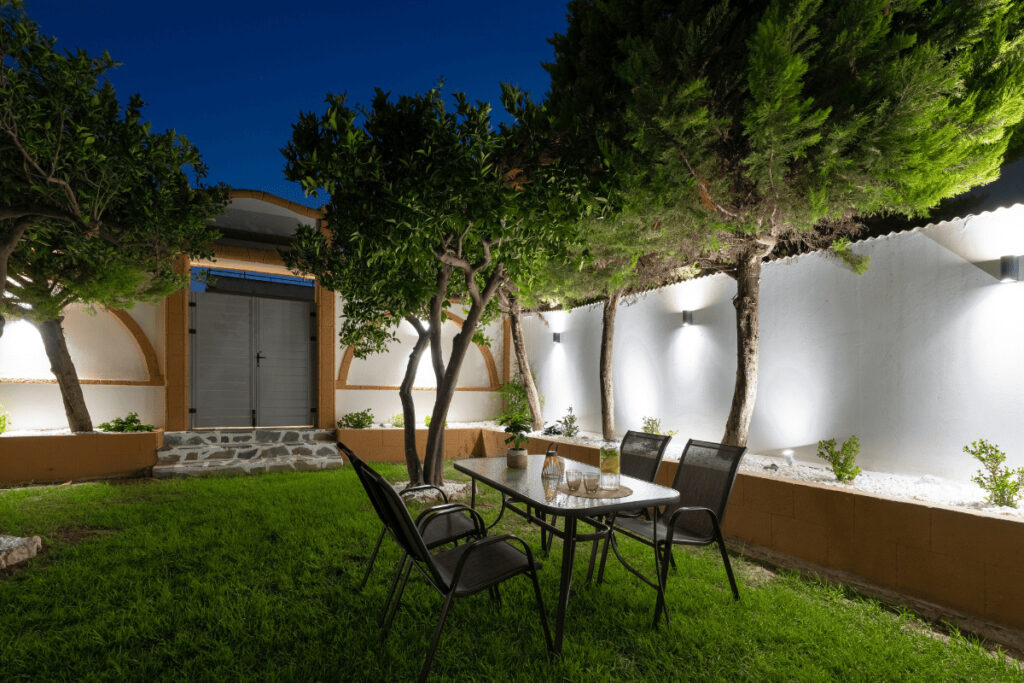 Garden with soft lighting at night in Duo Verde apartment in Kremasti Rhodes